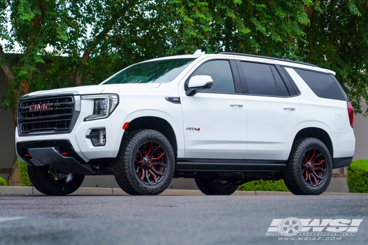 2023 GMC Yukon with 20" Fuel Rage D712 in Gloss Black (w/ Candy Red) wheels